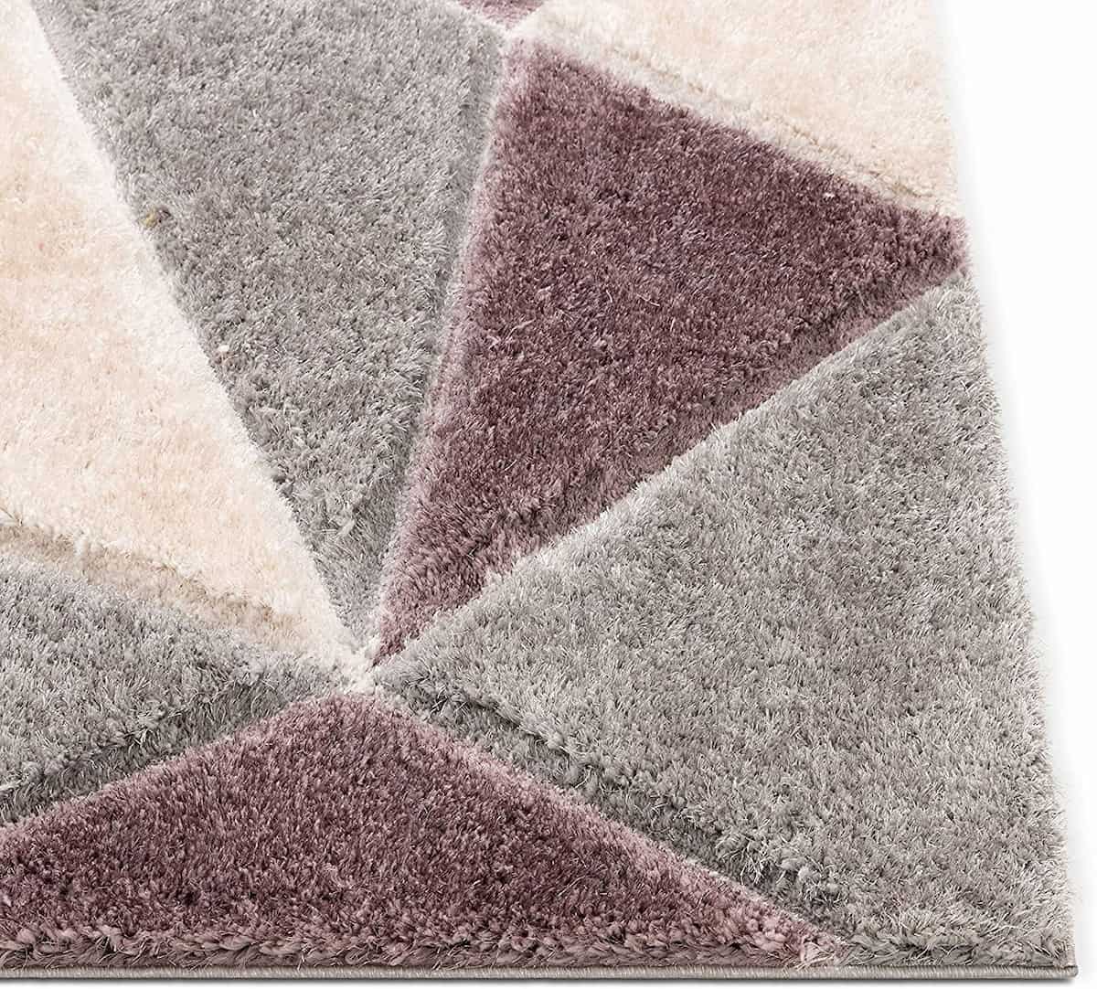 Close-up angle of RugNoor's triangle print shag carpet in grey and plum