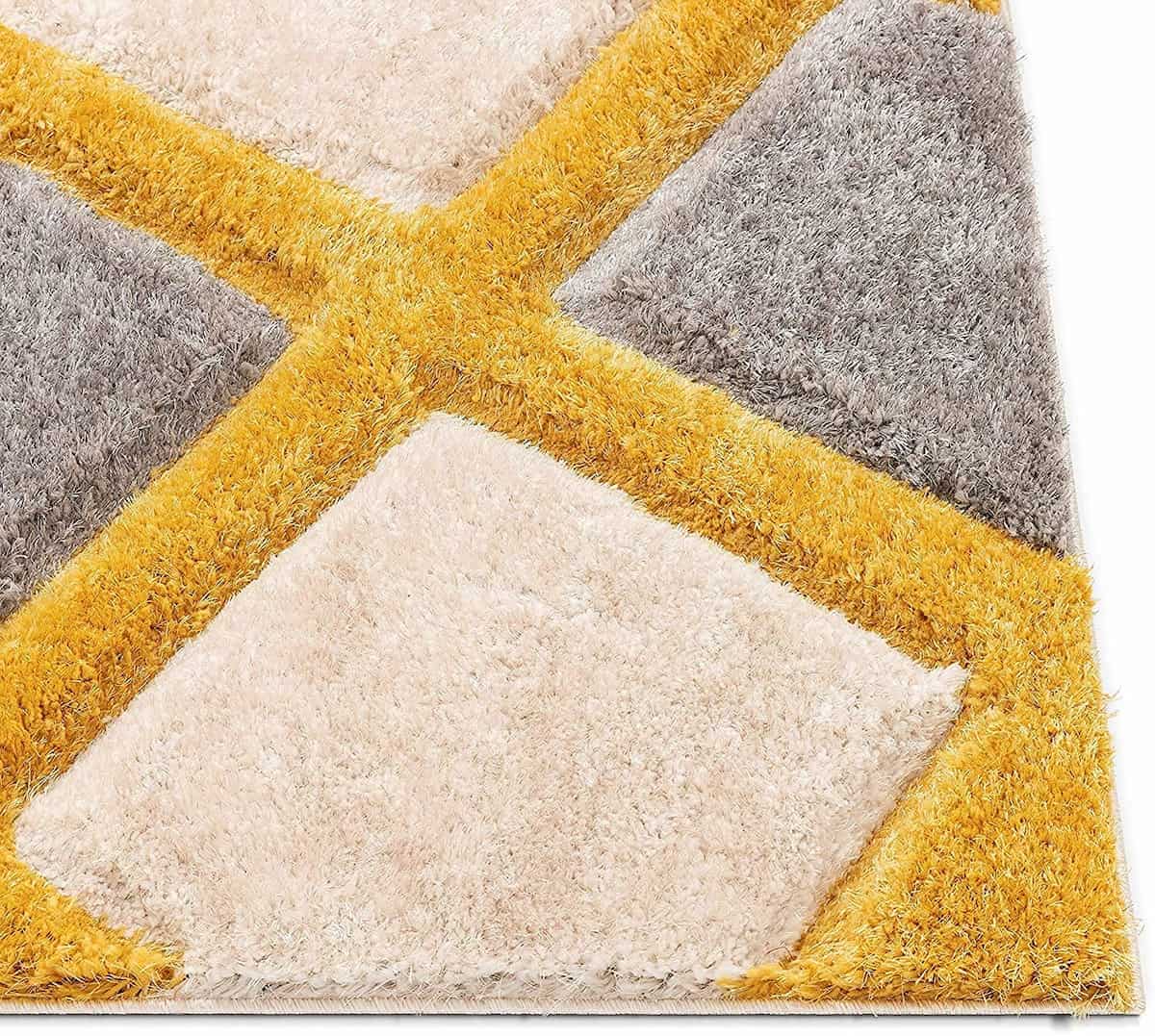 Angled close-up showing RugNoor's yellow trellis design against soft white pile