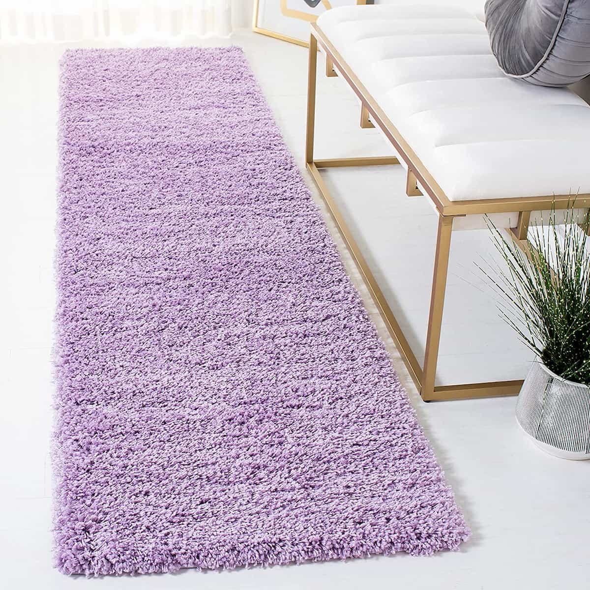 Lilac shag runner rug styled near bench and plant - RugNoor