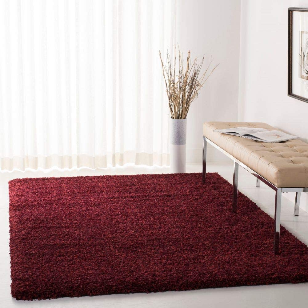 Maroon shag rug in bright room with bench and curtains - RugNoor