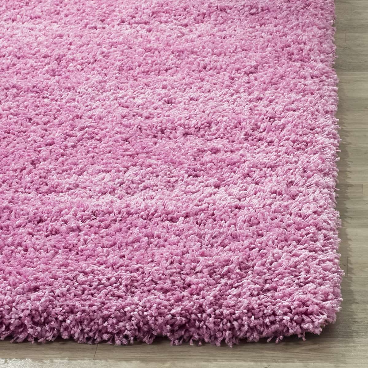 Pink shag rug full pile texture on wood floor - RugNoor