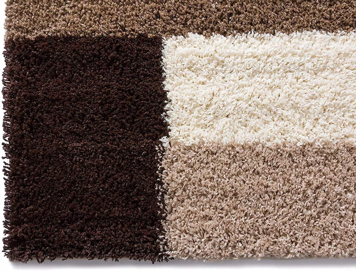 Four-panel shag rug blending shades of brown, beige and black