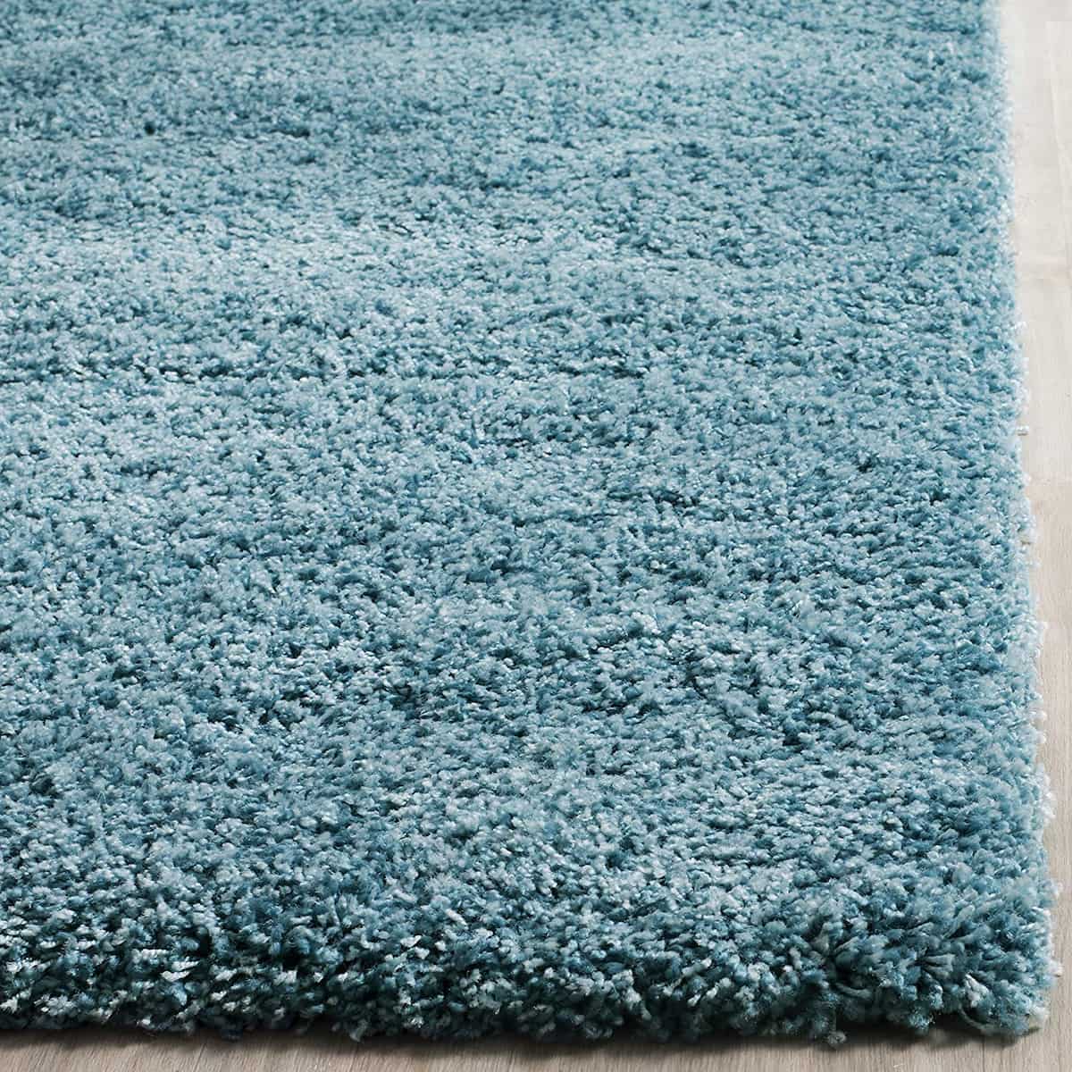 Turquoise shag rug corner close-up showing pile texture - RugNoor
