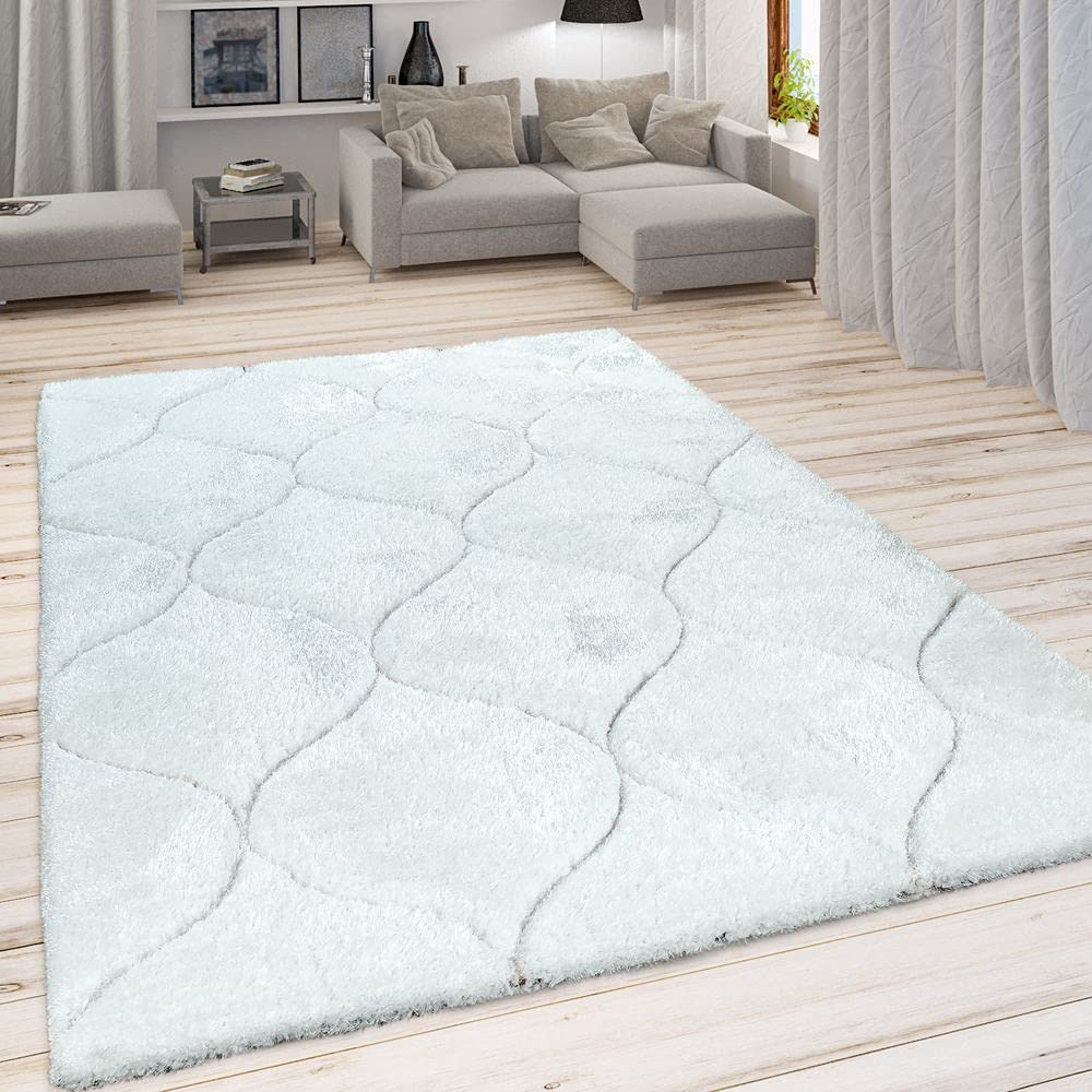 RugNoor's white shaggy carpet placed in a modern living room on a wooden floor with ogee trellis design pattern