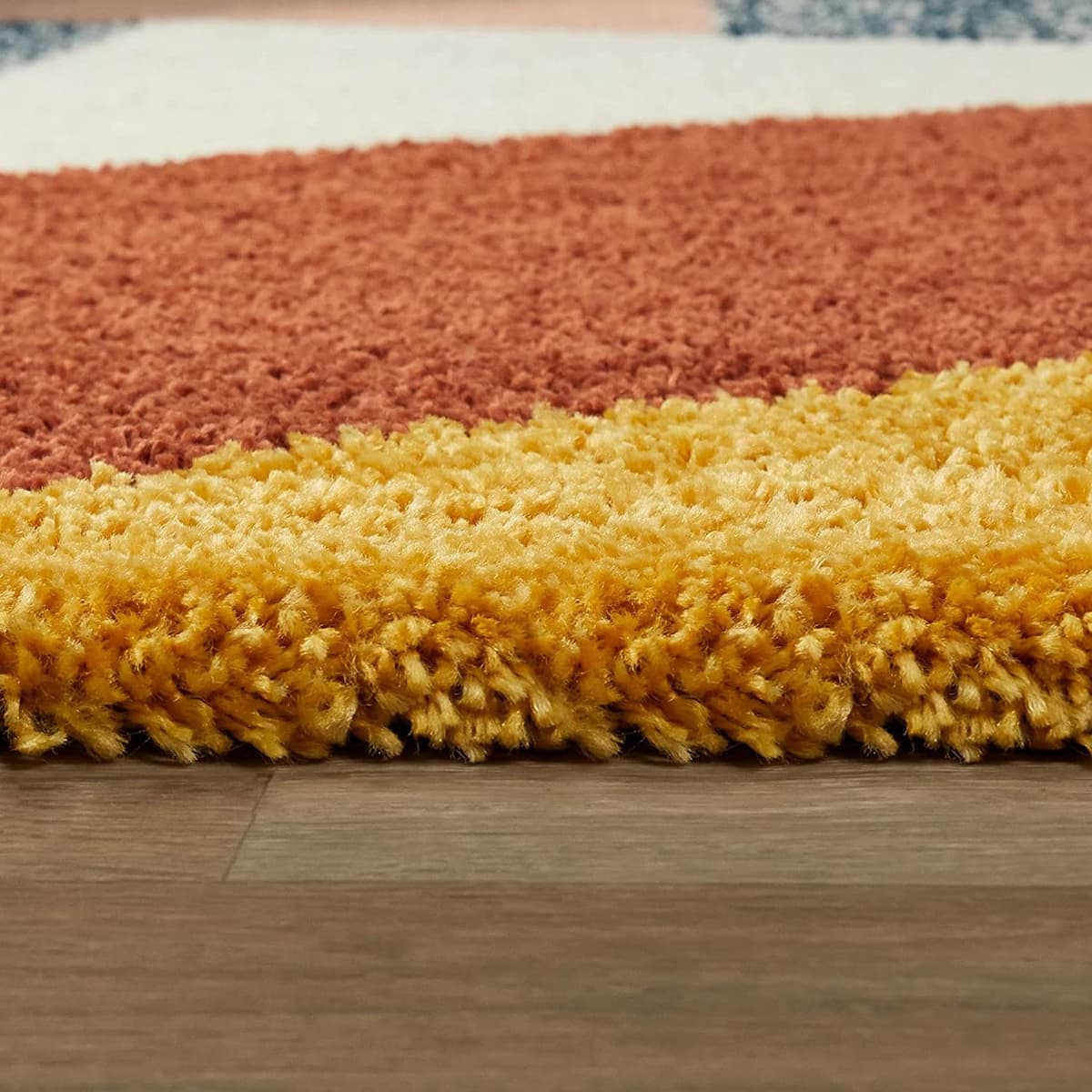 RugNoor close-up red yellow shag rug pile texture, soft fluffy carpet
